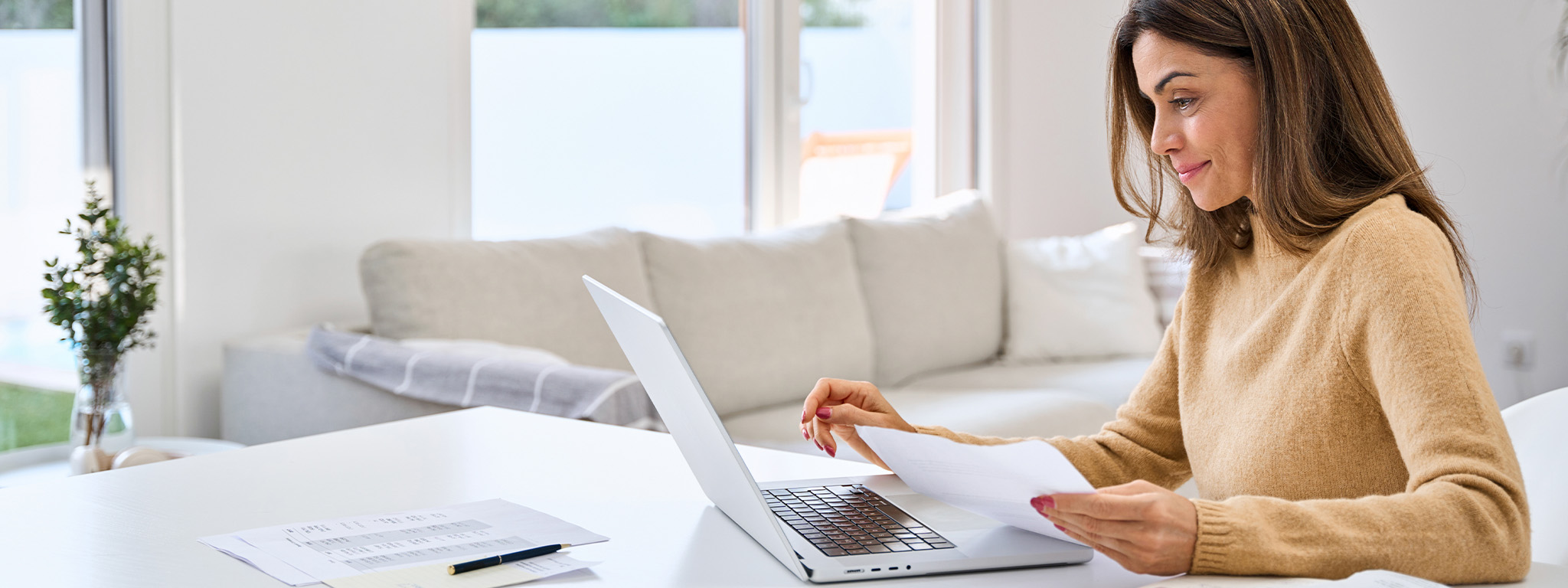 Person investigating Portugal mortgage loan documents - Desktop Banner 
