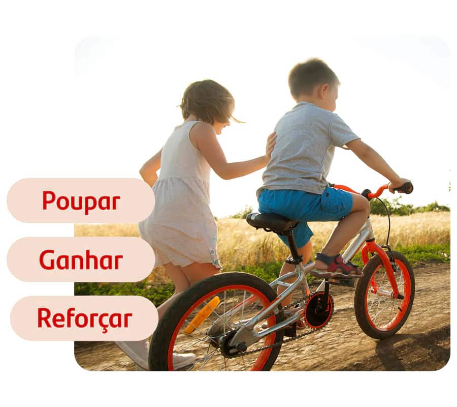 uma criança a pedalar em bicicleta com outra a pé ao seu lado